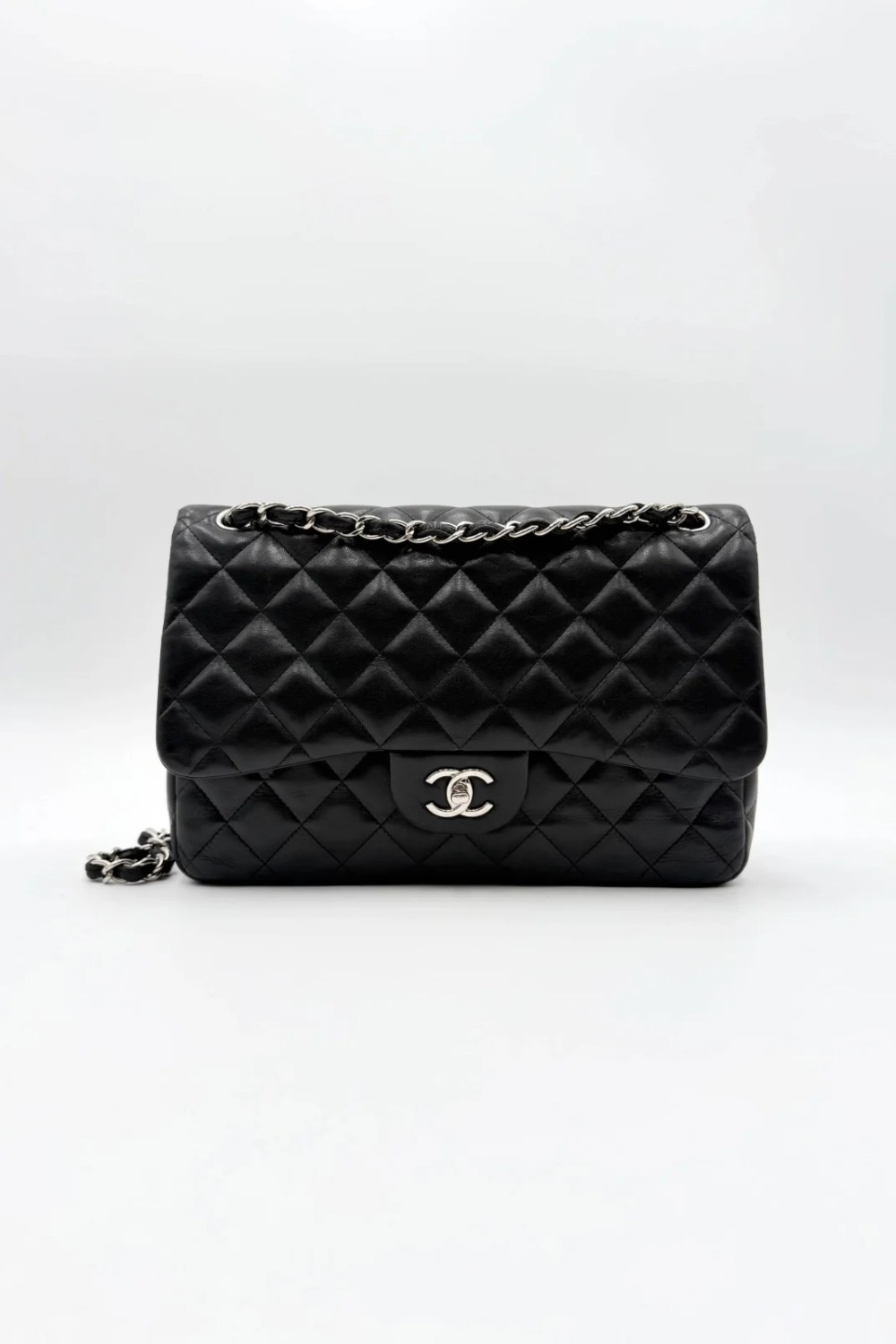Black Chanel Jumbo Double Flap Bag in lambskin leather with silver-tone hardware