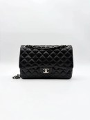 Black Chanel Jumbo Double Flap Bag in lambskin leather with silver-tone hardware