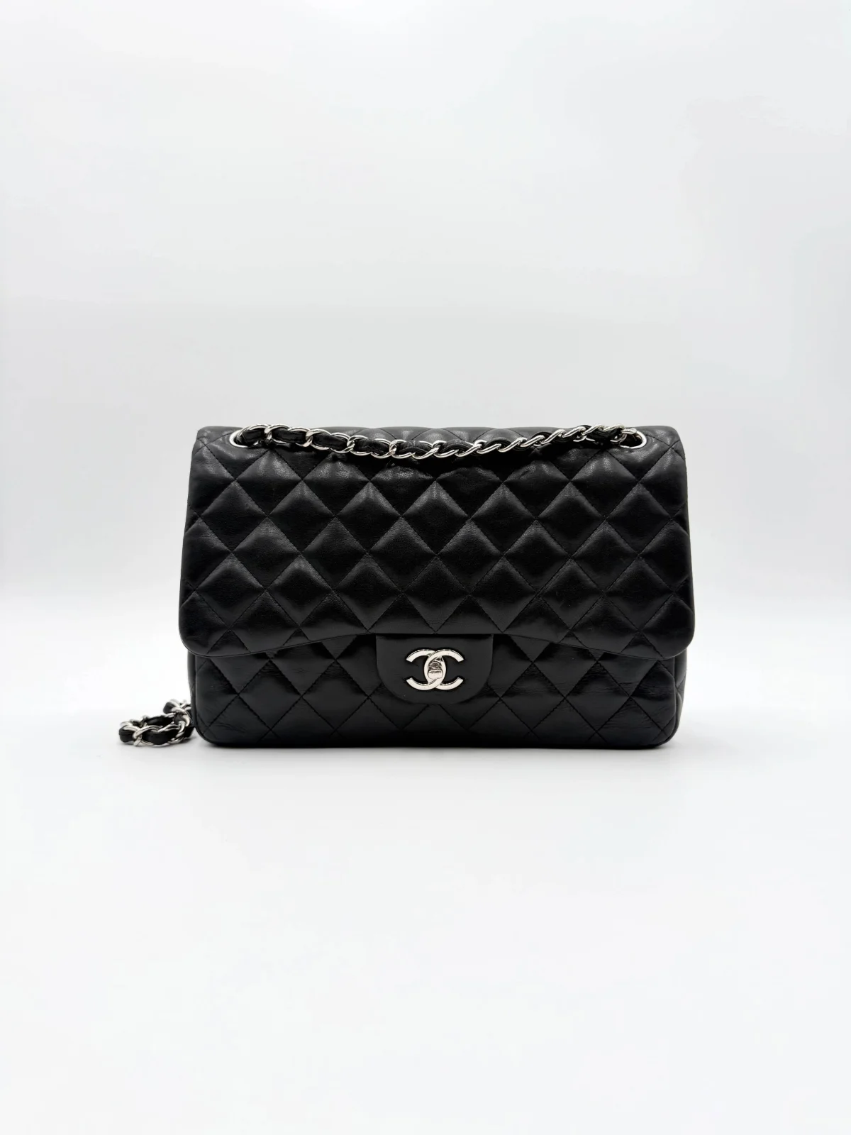 Black Chanel Jumbo Double Flap Bag in lambskin leather with silver-tone hardware