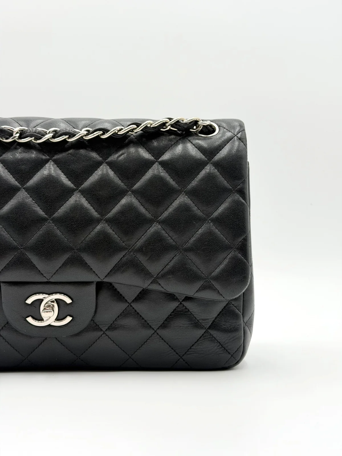 Black Chanel Jumbo Double Flap Bag in lambskin leather with silver-tone hardware
