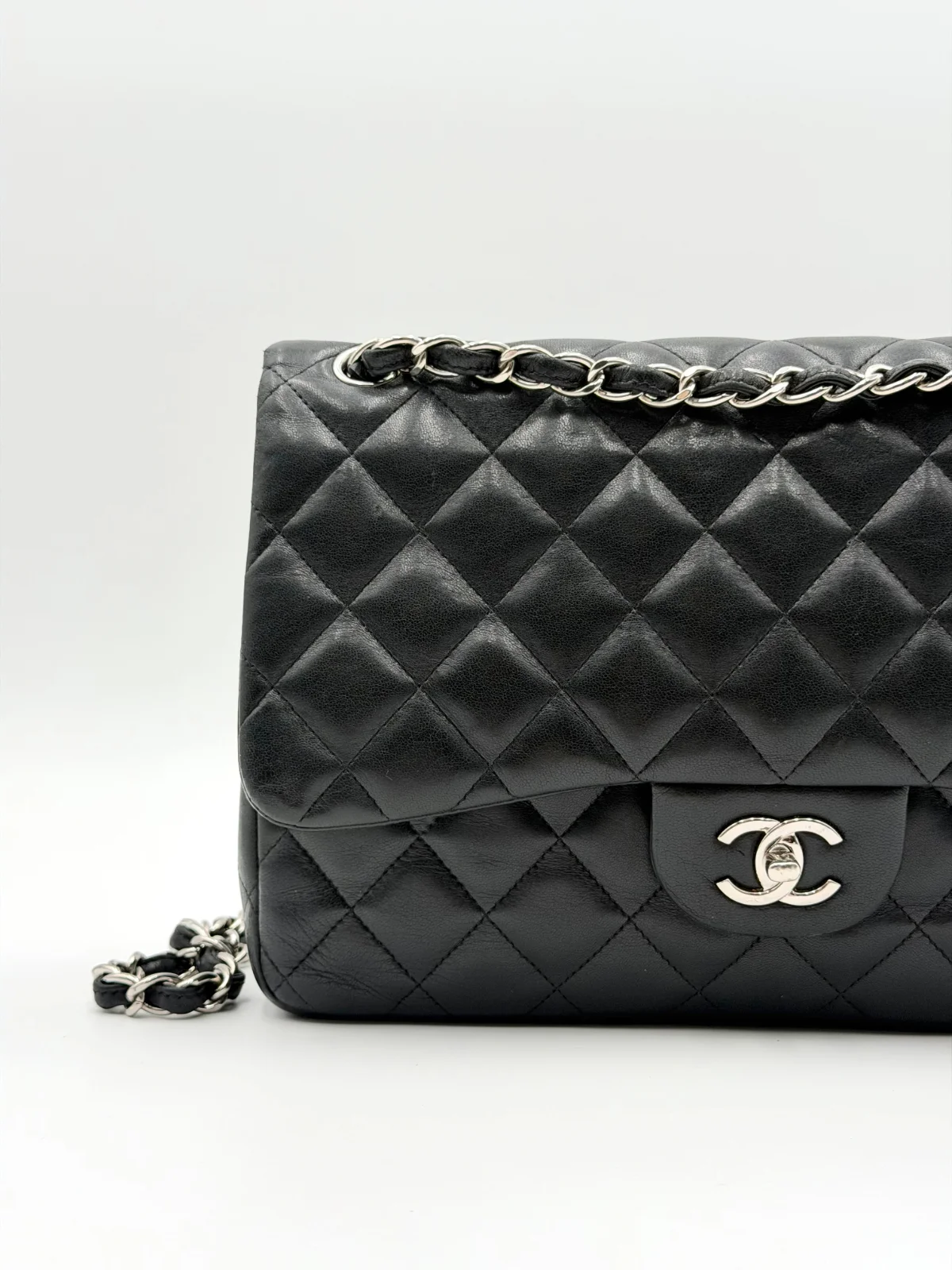 Black Chanel Jumbo Double Flap Bag in lambskin leather with silver-tone hardware