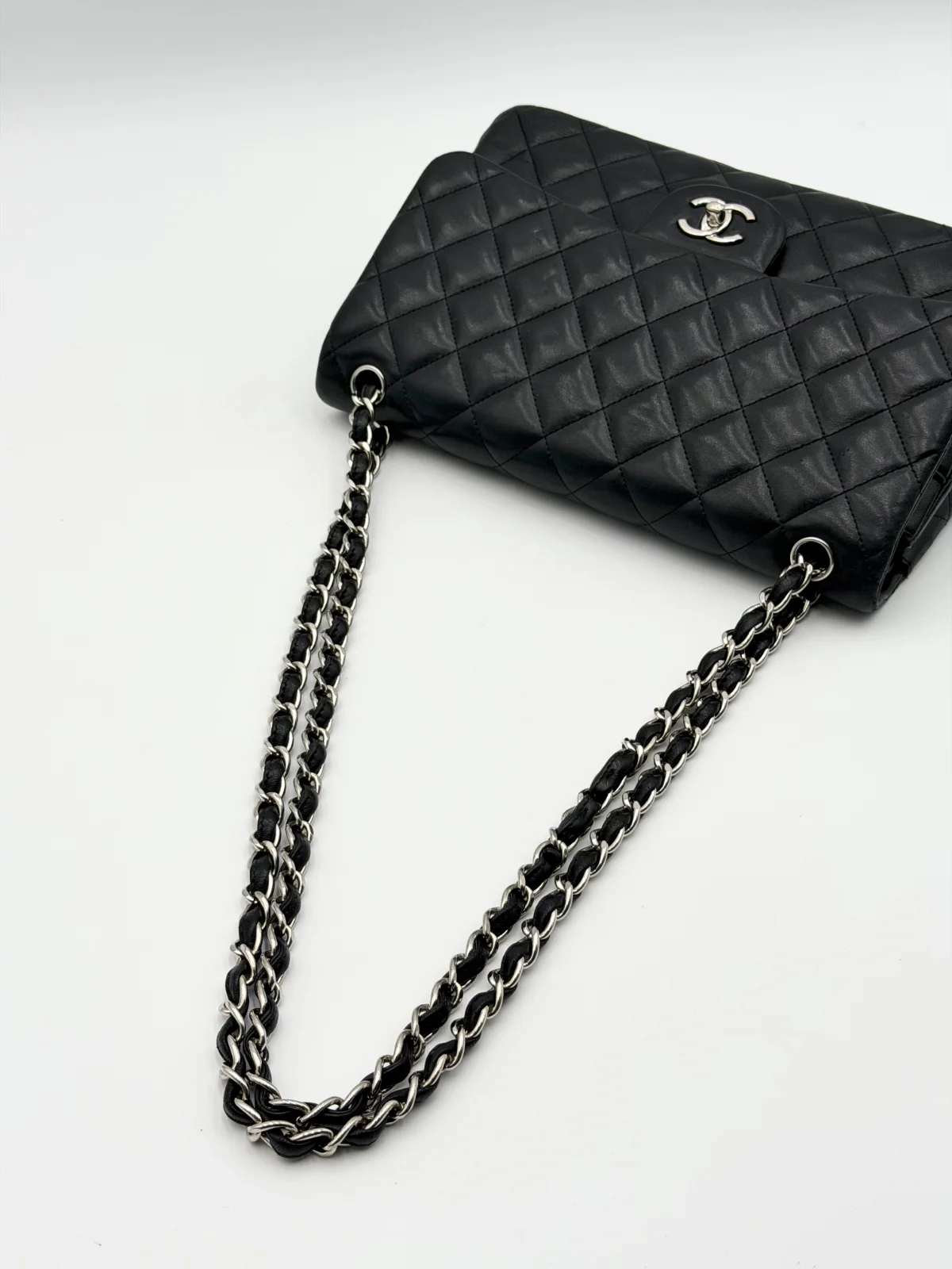 Black Chanel Jumbo Double Flap Bag in lambskin leather with silver-tone hardware