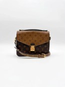 Brown Monogram Reverse Canvas Louis Vuitton Pochette Métis bag with gold-tone hardware