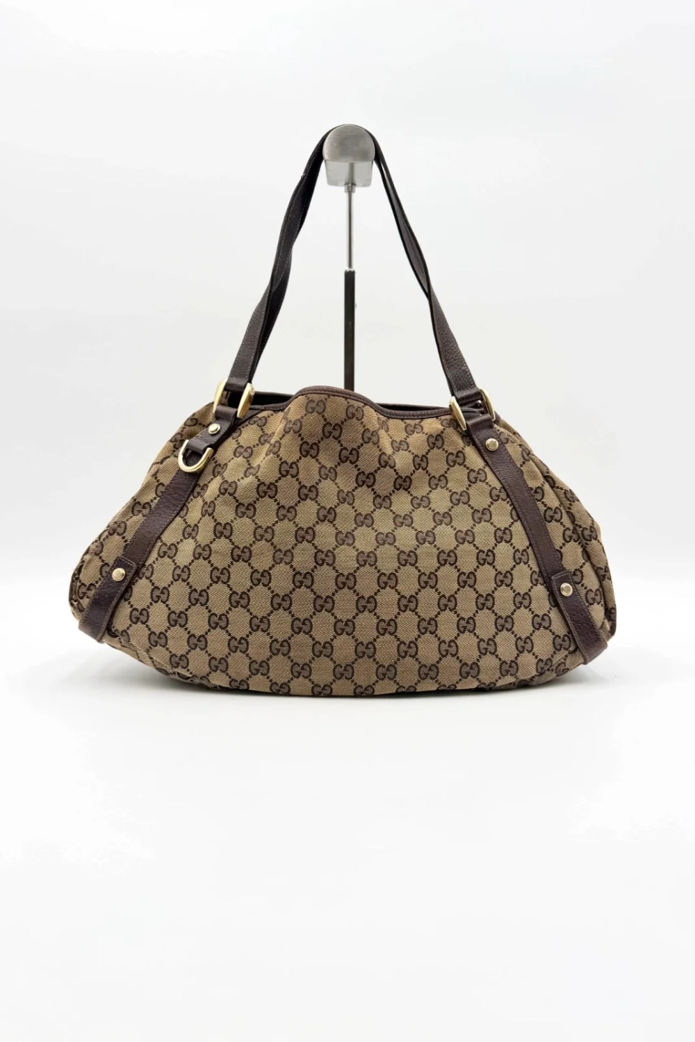Gucci Abbey handbag in brown GG canvas with champagne-tone hardware and an open top
